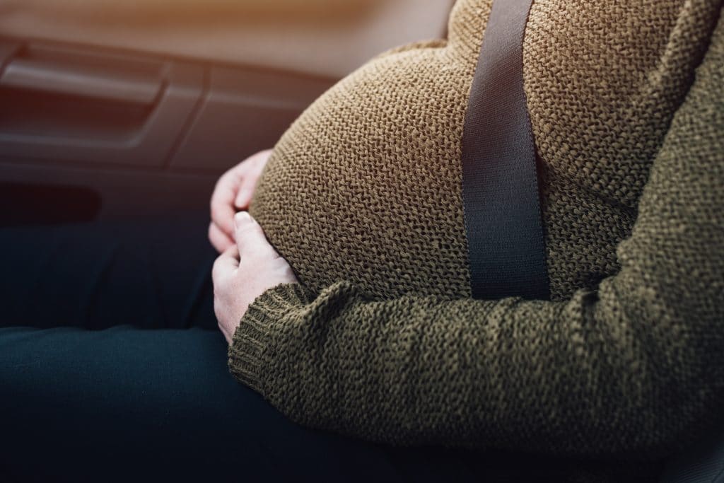 Pregnant woman with seat belt