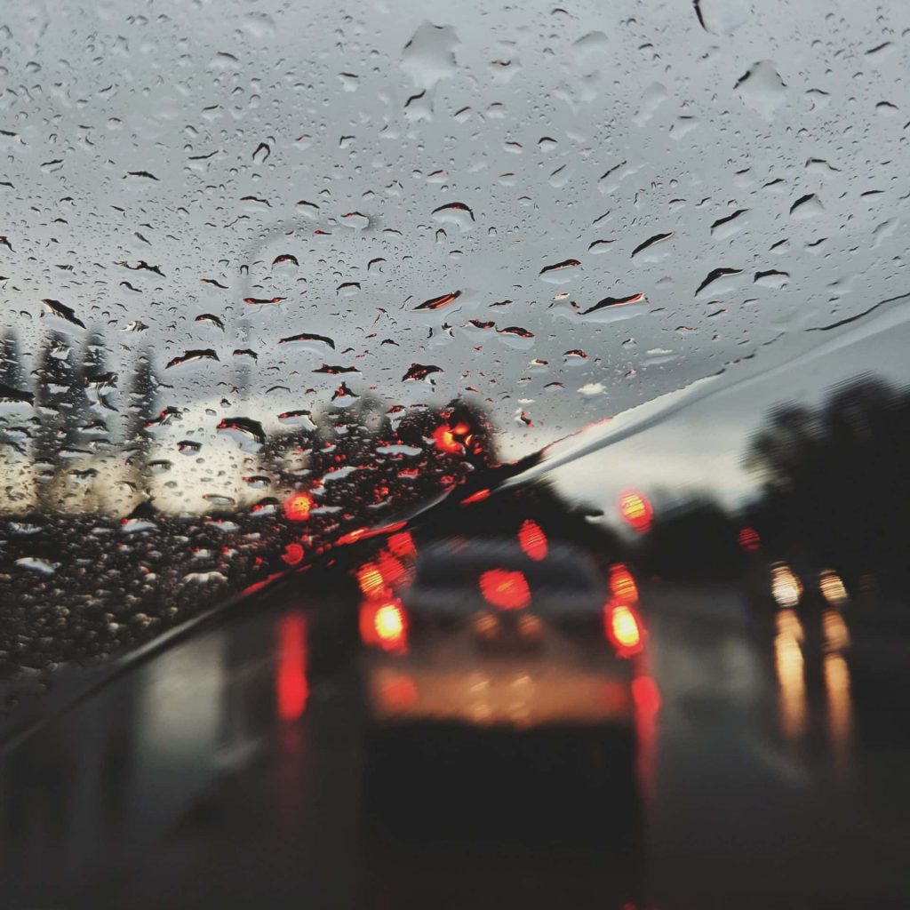 Rain covered windshield - Rain windshield being wiped
